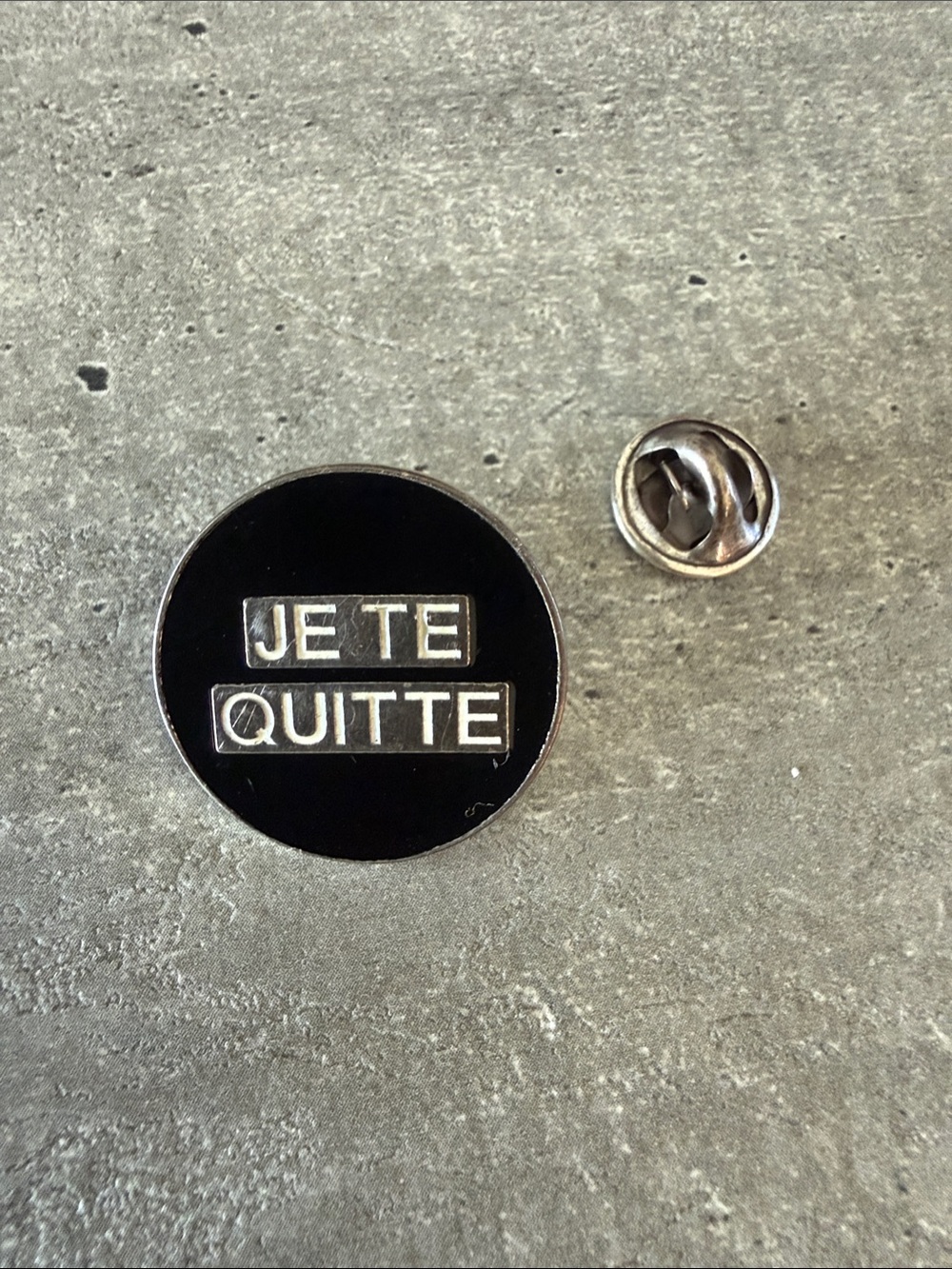 Authentic Saint Laurent Black and Silver 'JE TE QUITTE' Round Cuff Pin